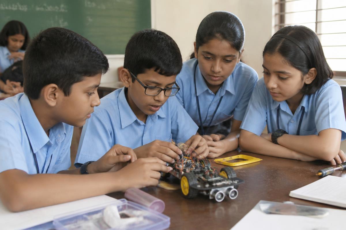 School students building robotics projects