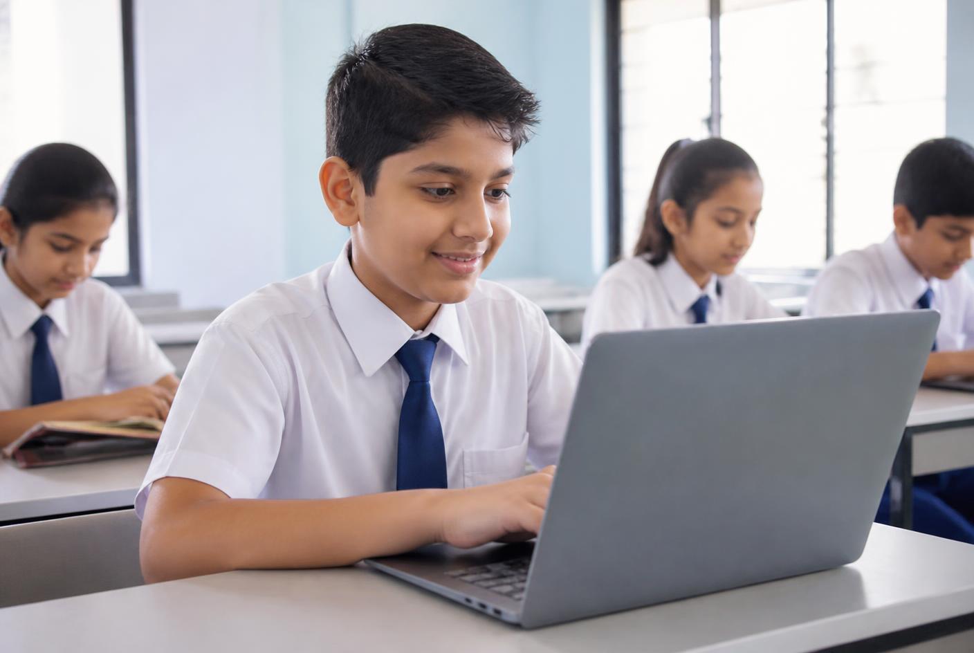 School children learning to code with a teacher